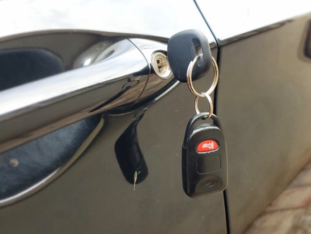 Car key with remote fob in door lock locksmith service